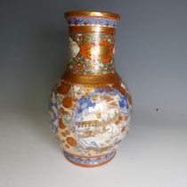 An antique Japanese imari palette Vase, the underglaze blue profusely decorated with colourful