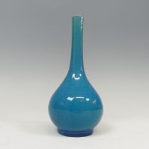 A small 19thC Chinese monochrome ovoid Bottle Vase, in shades of blue with long slender neck and