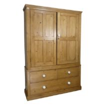 A large Victorian pine Housekeepers Cupboard, later cornice above two large panelled cupboard