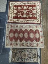 Tribal Rugs; a small silk Kashmiri Mat, 72cm x 30cm, together with two other small rugs, one with