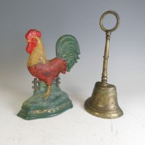 A Georgian brass bell shaped Door Stop, together with a vintage painted Door Stop in the form of a