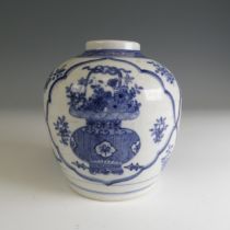 A late 19th/early 20thC Chinese blue and white Ginger Jar, decorated with floral baskets within