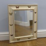 A painted wall Mirror, border depicting butterflies, W 42.5 cm x H 53 cm.