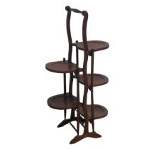 An Edwardian mahogany five-tier folding cake Stand, W 45 cm x H 91 cm x D 25.5 cm.