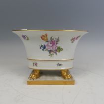 A Herend hand painted porcelain oval Cachepot, painted with flowers and raised on gilt lion claw