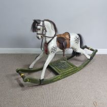 A good early 20th century carved and painted rocking Horse, with saddle, hair, and glass eyes, quote