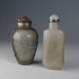 A 19thC Chinese jade Snuff Bottle, of shouldered rectangular form, with associated top with silver
