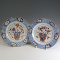 A pair of 18thC Chinese rose imari porcelain Plates, decorated to the well with flower basket and