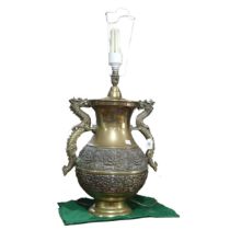 A Chinese style brass twin handled table Lamp, handles in the shapes of dragons, H 75 cm.