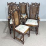 A set of six Carolean style oak dining Chairs, carved scroll pediments flanked by turned finials,