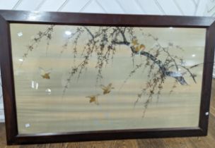 A large early 20th century Japanese embroidered silk picture, depicting a branch with blossom and