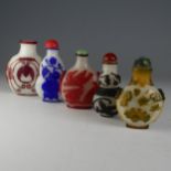 A small quantity of Chinese overlayed glass Snuff Bottles, to comprise one with central bat motif on