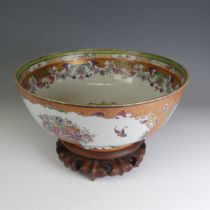A late 18thC Chinese mandarin palette Punch Bowl, decorated in colouful flora enamels within