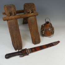 An antique tribal wooden camel Saddle, W 34 cm x H 35 cm x D 46 cm, together with a West African