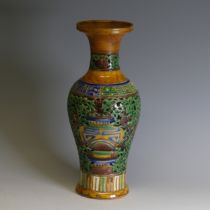 A Chinese double walled reticulated Vase, of baluster form, in ochre ground with blue and green