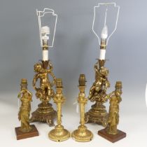 A pair of 20th century gilt brass Cherub table Lamps, raised on scroll and pierced bases, H 66 cm,