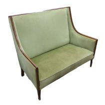 An Edwardian mahogany Show Frame upholstered Two Seat Sofa, with strip inlay, raised on spaded feet,