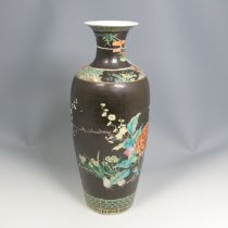 An antique Chinese famille noir porcelain Vase, black ground with colourful enamels of prunus and