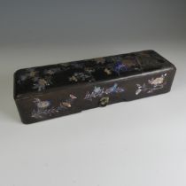 An antique Japanese lacquer Scholar's Box, decorated heavily with mother of pearl inlays depicting