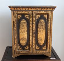 A 19th century hand painted gilt and black lacquer chinoiserie jewellery Cabinet, of small