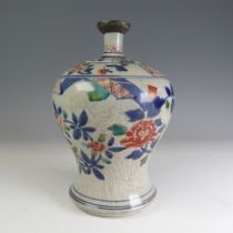 An antique Chinese Wucai porcelain Vase, of baluster form and slender neck, with antique repair,