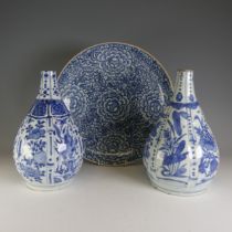 An antique Chinese blue and white bottle Vase, decorated underglaze in flora and fauna, the neck cut