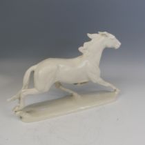 A large Rosenthal white porcelain model of a galloping Horse, stamped 'Rosenthal Germany