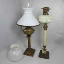 A Victorian Oil Lamp, uranium scrolled glass reservoir, raised on alabaster column and stepped base,