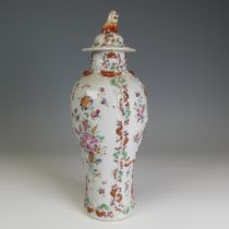 A 19thC Chinese export porcelain slender baluster Vase, and cover, decorated in floral motifs with