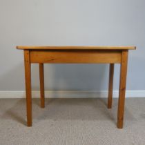 A small antique stained pine side Table, in the style of a kitchen Table, rectangular top raised