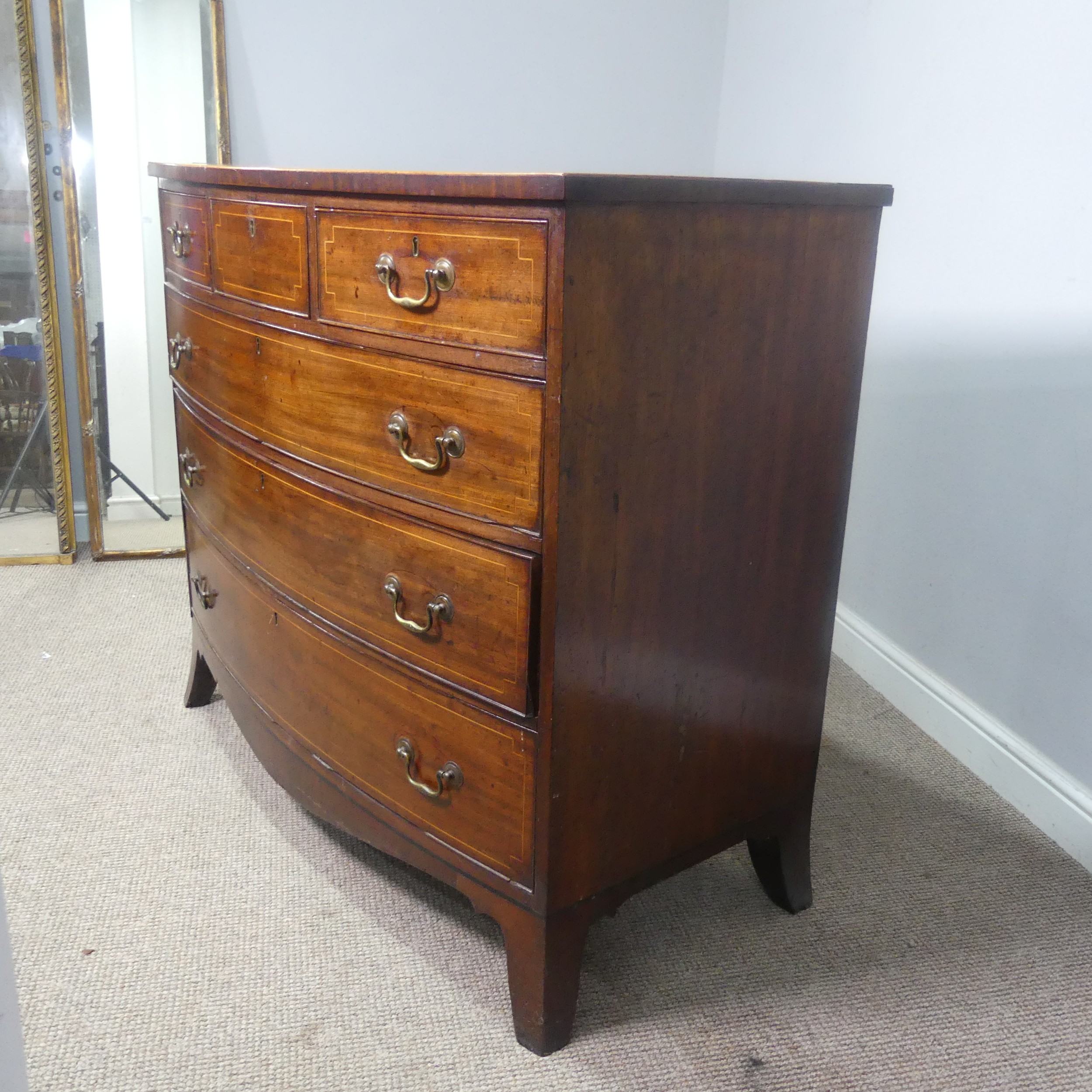 A Georgian mahogany bow-front Chest of drawers, three small drawers over three long graduating - Image 5 of 10