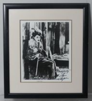 WITHDRAWN - A black and white film still reprint of Charlie Chaplin in “The Gold Rush” (1925) weari
