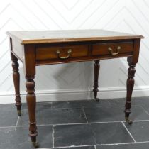 A Victorian mahogany Writing Table, moulded top inset with gilt tooled leather writing surface,