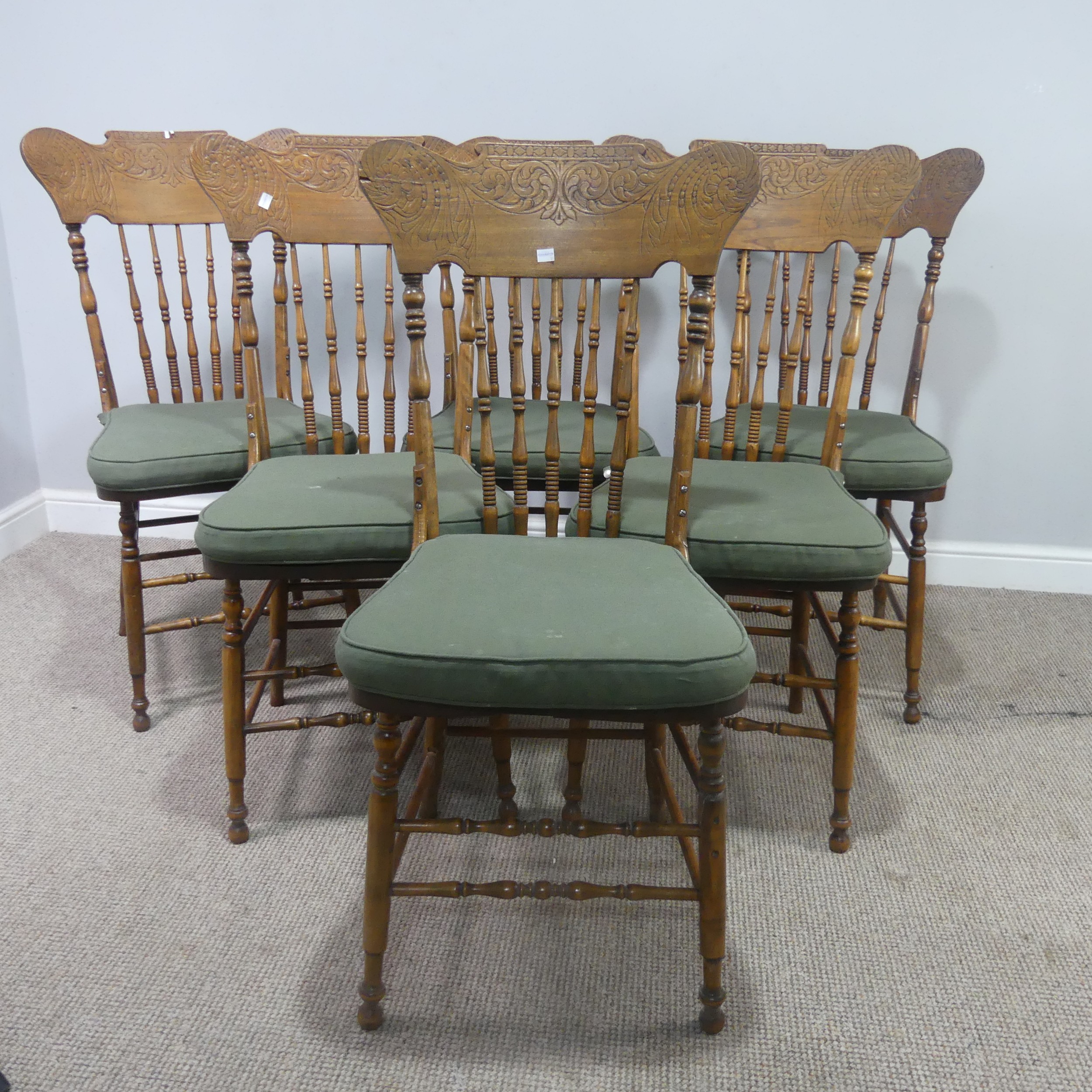 A set of six early 20th century Canadian Art Nouveau style spindle-back Dining Chairs, shaped carved