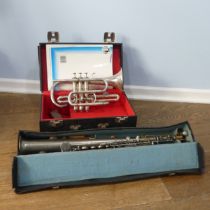 A cased French silver plated soprano Saxophone, with makers mark and mouth piece, together with a