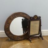 An early 20th century oval Wall Mirror, with carved oak frame, W 57 cm x H 50 cm, together with a