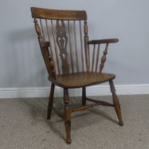 An antique ash and elm windsor Armchair, legs cuts down and with old metal repairs, W 57 cm x H 85