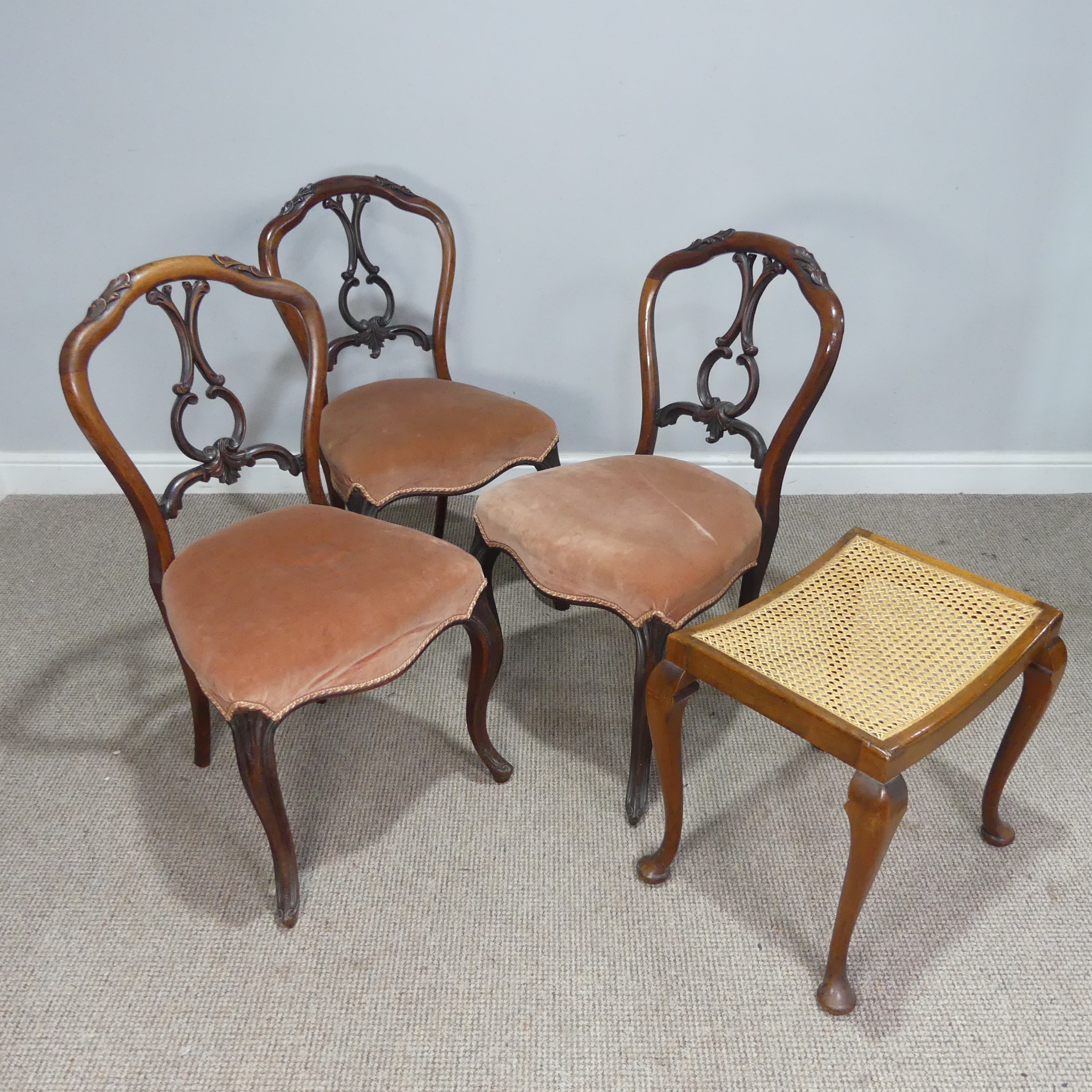 A set of three 19th century mahogany balloon-back Dining Chairs, carved pierced splat back above