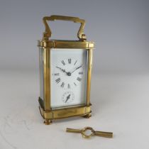 A 20th century French alarm carriage Clock, enamelled white dial with Roman numerals and