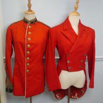 An early 20th century Household Cavalry red Tunic, the brass buttons with motto, crown and 'Honi