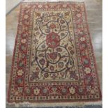 Tribal Rugs; a finely hand-knotted old Isfahan silk rug, of classic design, the cream ground woven