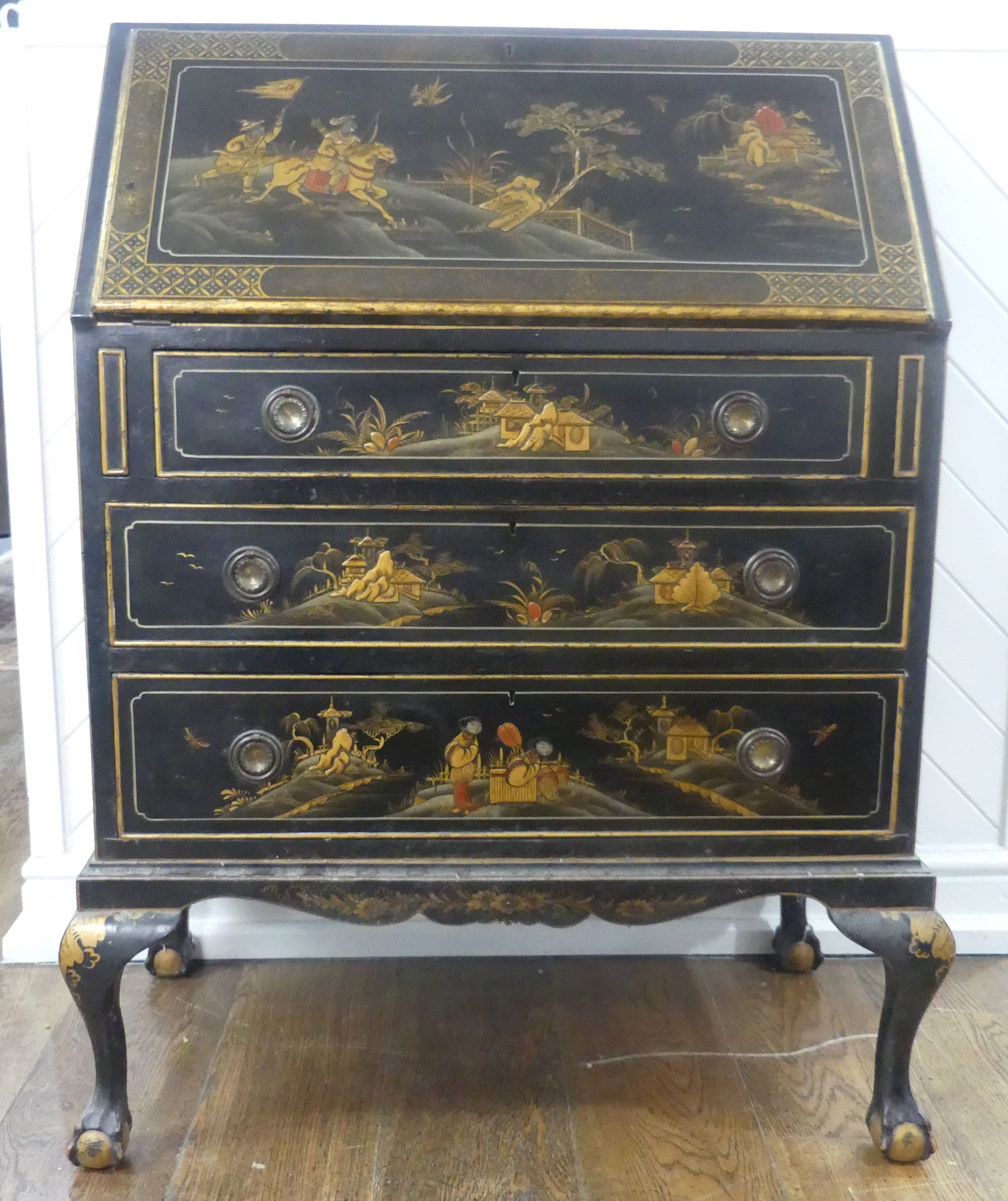 An early 20th century Chinoiserie Bureau, black lacquered and gilt painted decorations, sloped