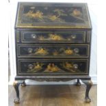 An early 20th century Chinoiserie Bureau, black lacquered and gilt painted decorations, sloped