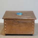 An Arts and Crafts copper fireside / log Box, sloped hinge top with very large central cabochon /