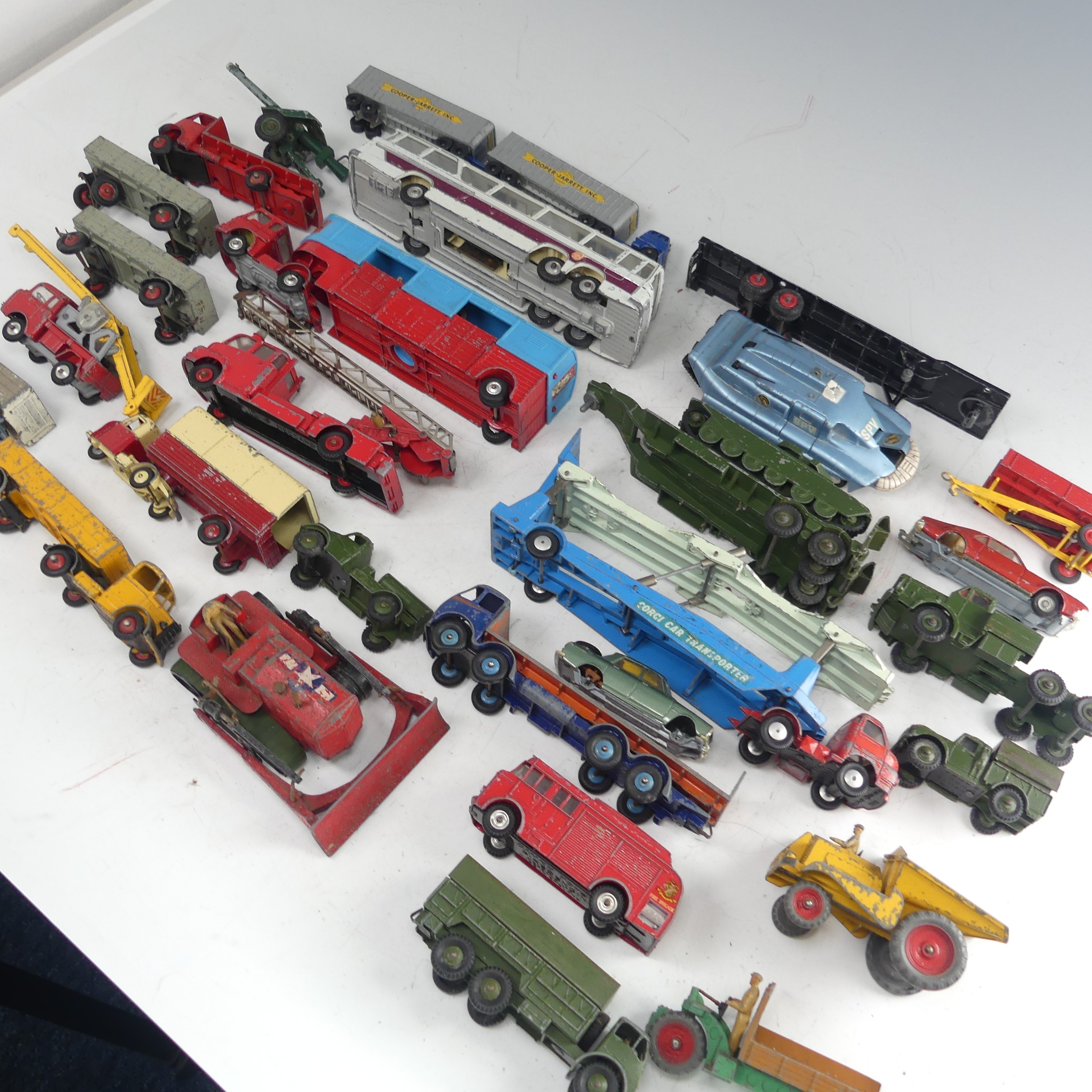 A collection of play-worn die-cast metal toy model cars, commercial and army vehicles, mostly