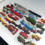 A collection of play-worn die-cast metal toy model cars, commercial and army vehicles, mostly