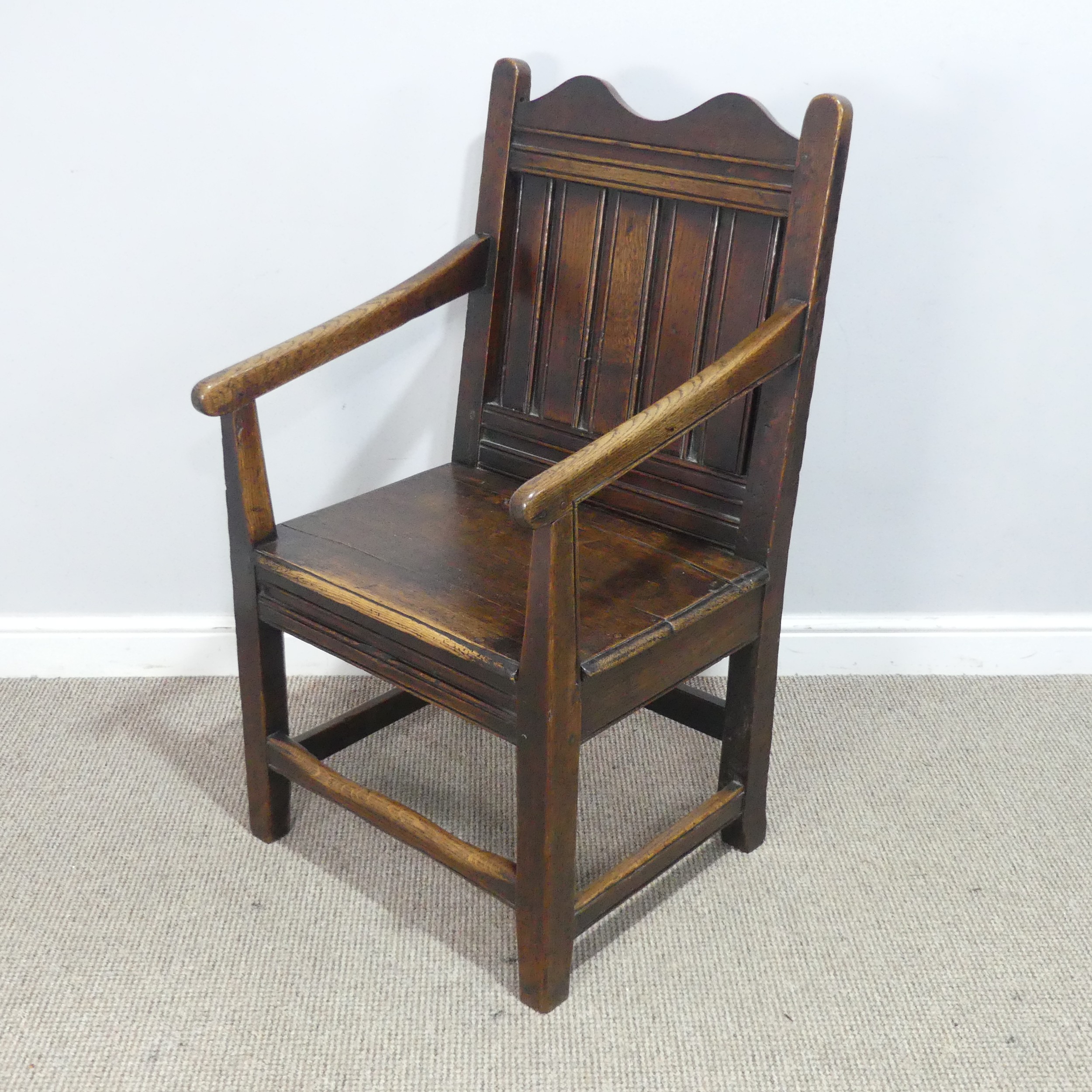 An 18th century wainscot style oak Armchair, shaped headrest over panelled backrest and flanked by - Image 3 of 5