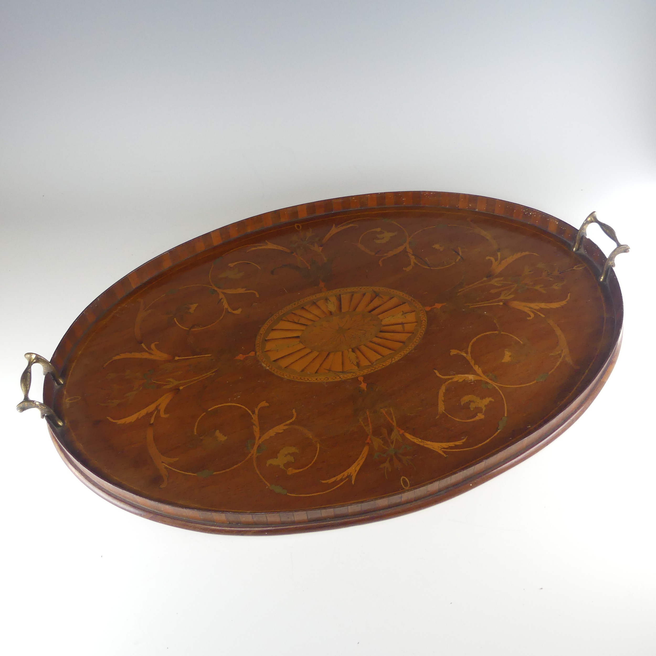 An Edwardian mahogany and marquetry galleried twin-handled Tray, the gallery of chequerboard boxwood