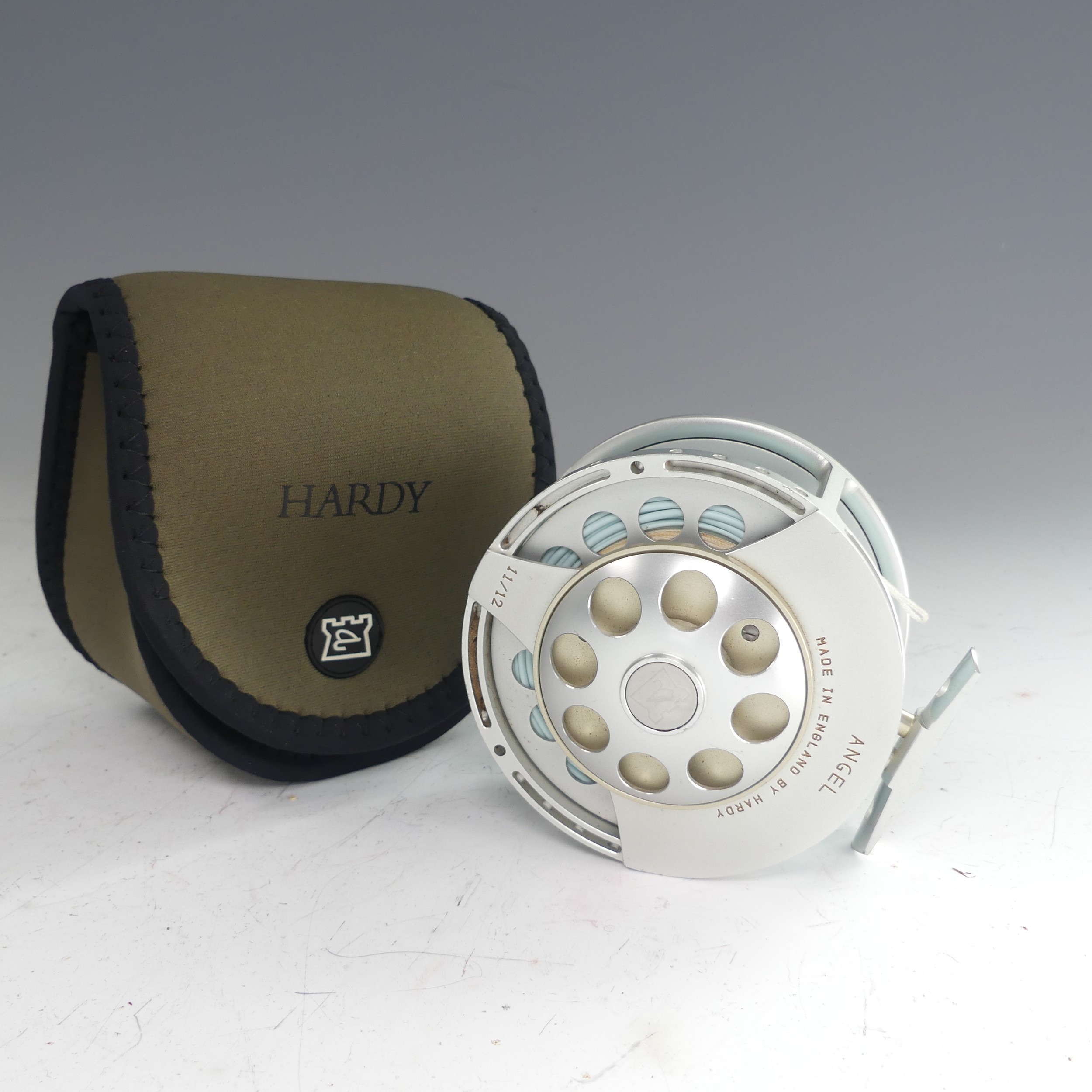 A Hardy Angel 11/12 fishing Reel, no. A26720, with Hardy pouch, 11.5cm diameter. - Image 3 of 5