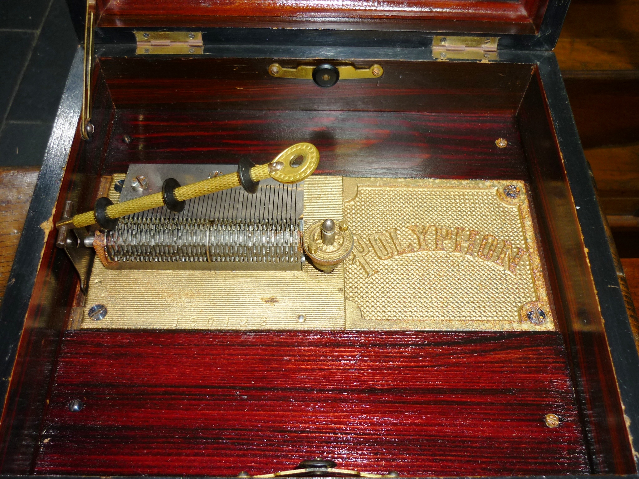 A late 19th century walnut cased Polyphon, with decorative hinged lid, the inside lid with - Image 5 of 6